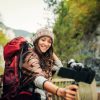 Young Female Vlogger In The Nature Holding A Camera